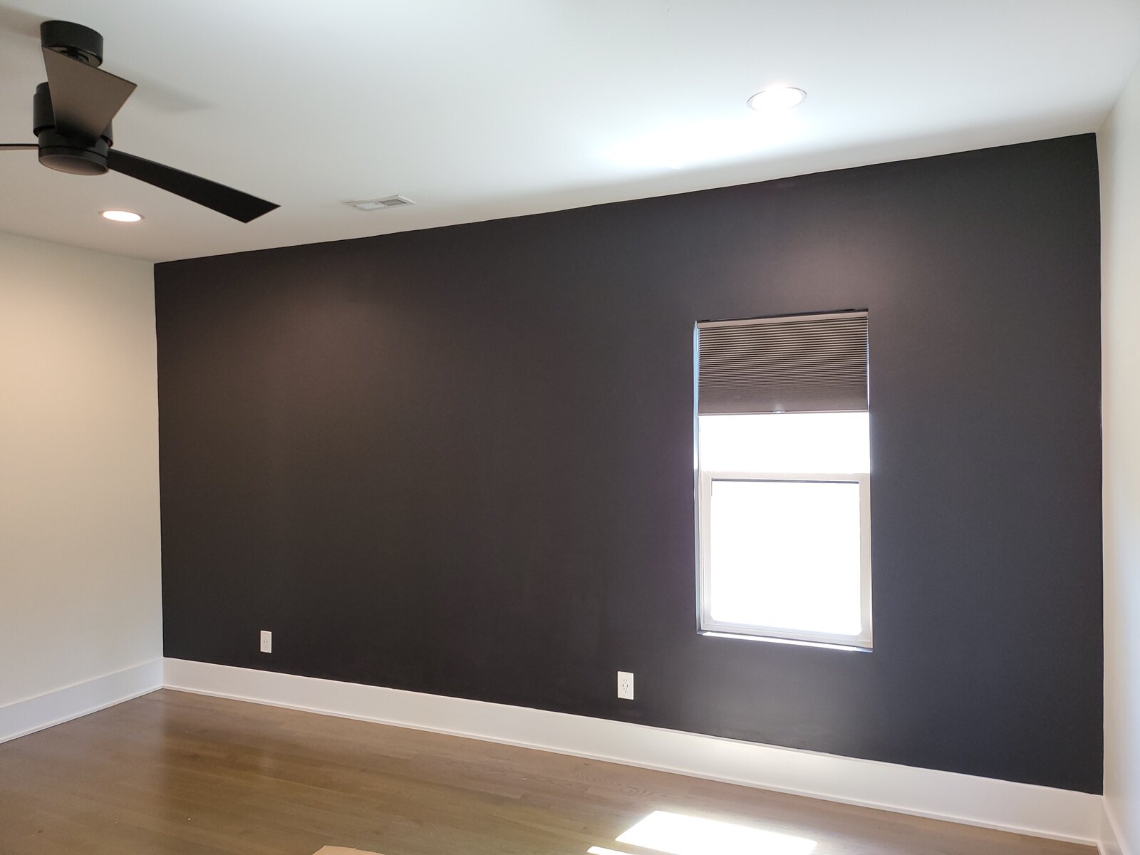 A finished interior accent wall repaint by ABC Paint Co